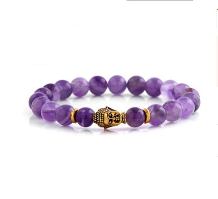 Intricately carved Buddha head charm on spiritual bracelet