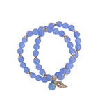 Blue Chalcedony beaded double-wrap bracelet with silver charms on white background