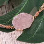 Close-up of natural raw Rose Quartz centerpiece on wrap bracelet