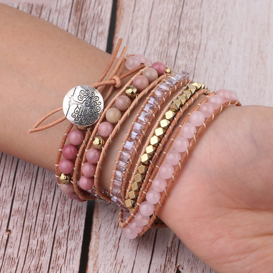 Woman wearing 'Boho Love' Rose Quartz wrap bracelet on arm