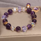 Overhead view of Amethyst and dazzling charm bracelet on a display