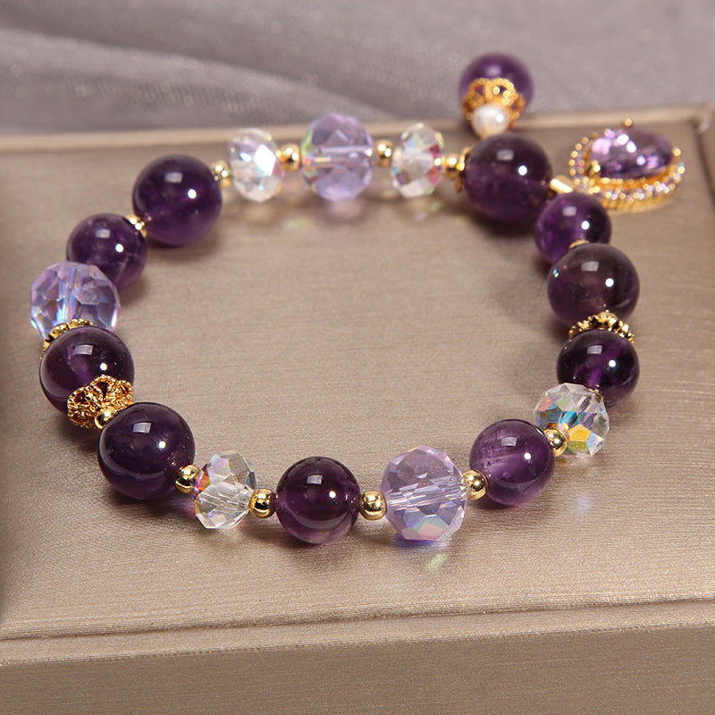 Overhead view of Amethyst and dazzling charm bracelet on a display